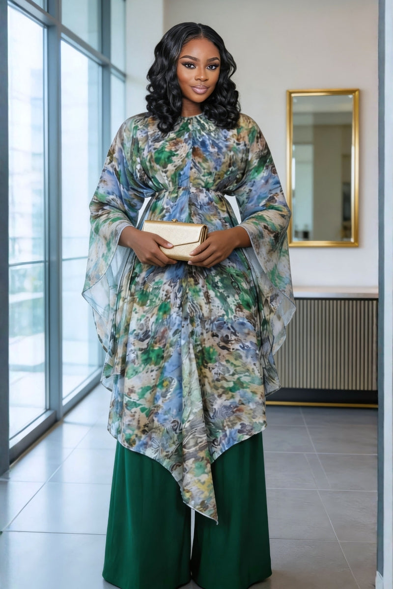 Woman in a floral dress standing in a modern interior setting